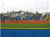 Softball Game Being Played on a Field