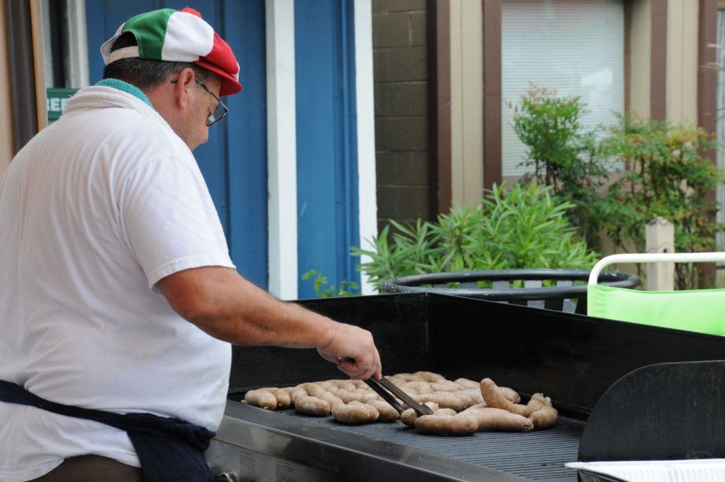 Man Grilling Sausages