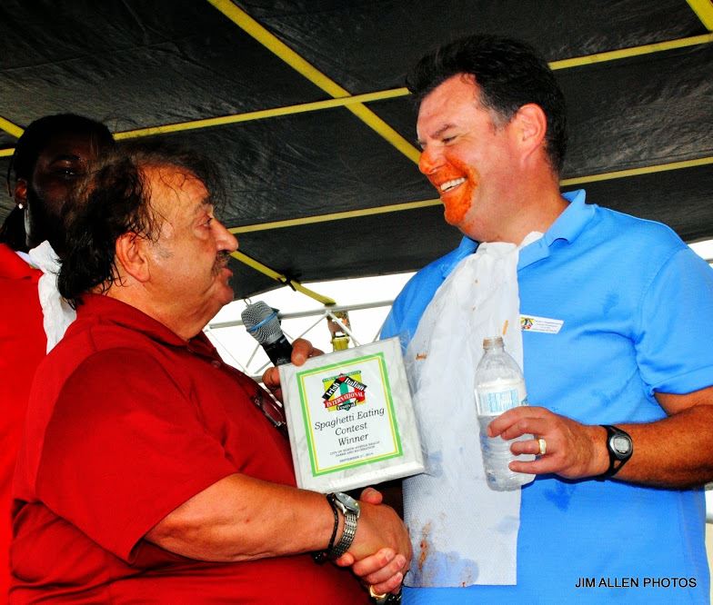 Man Being Presented with the Spaghetti Eating Contest Award