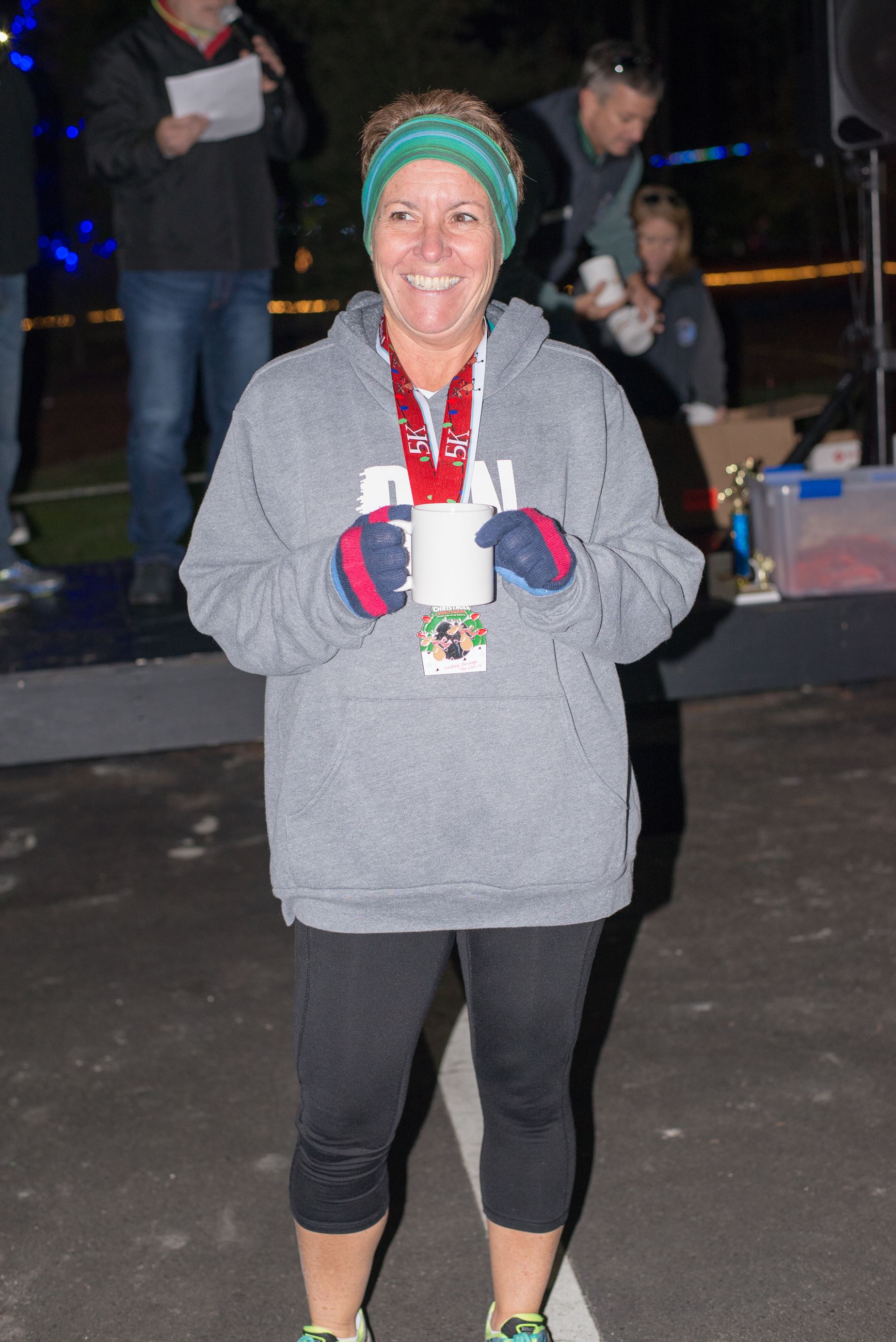 Woman Holding a Mug and Smiling