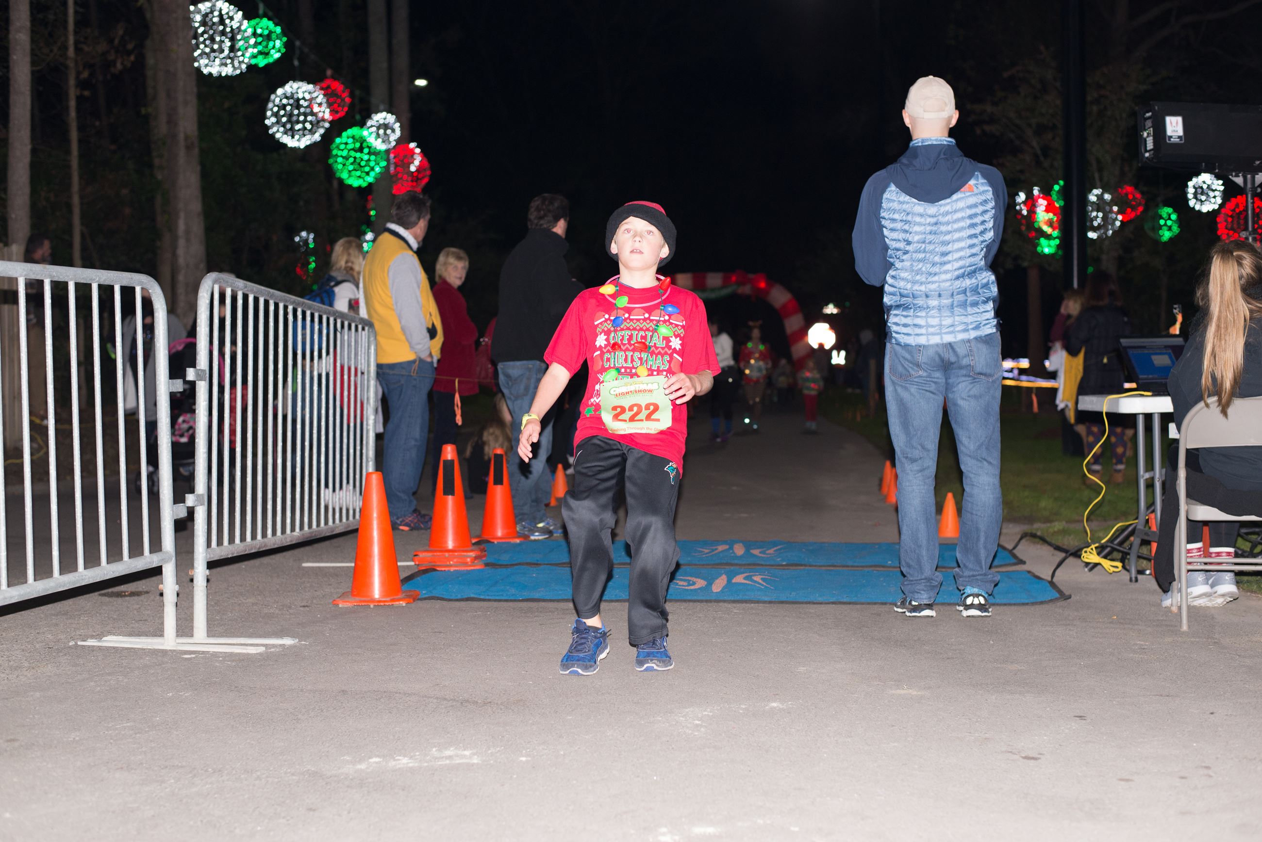 Young Boy Standing Across the Finish Line
