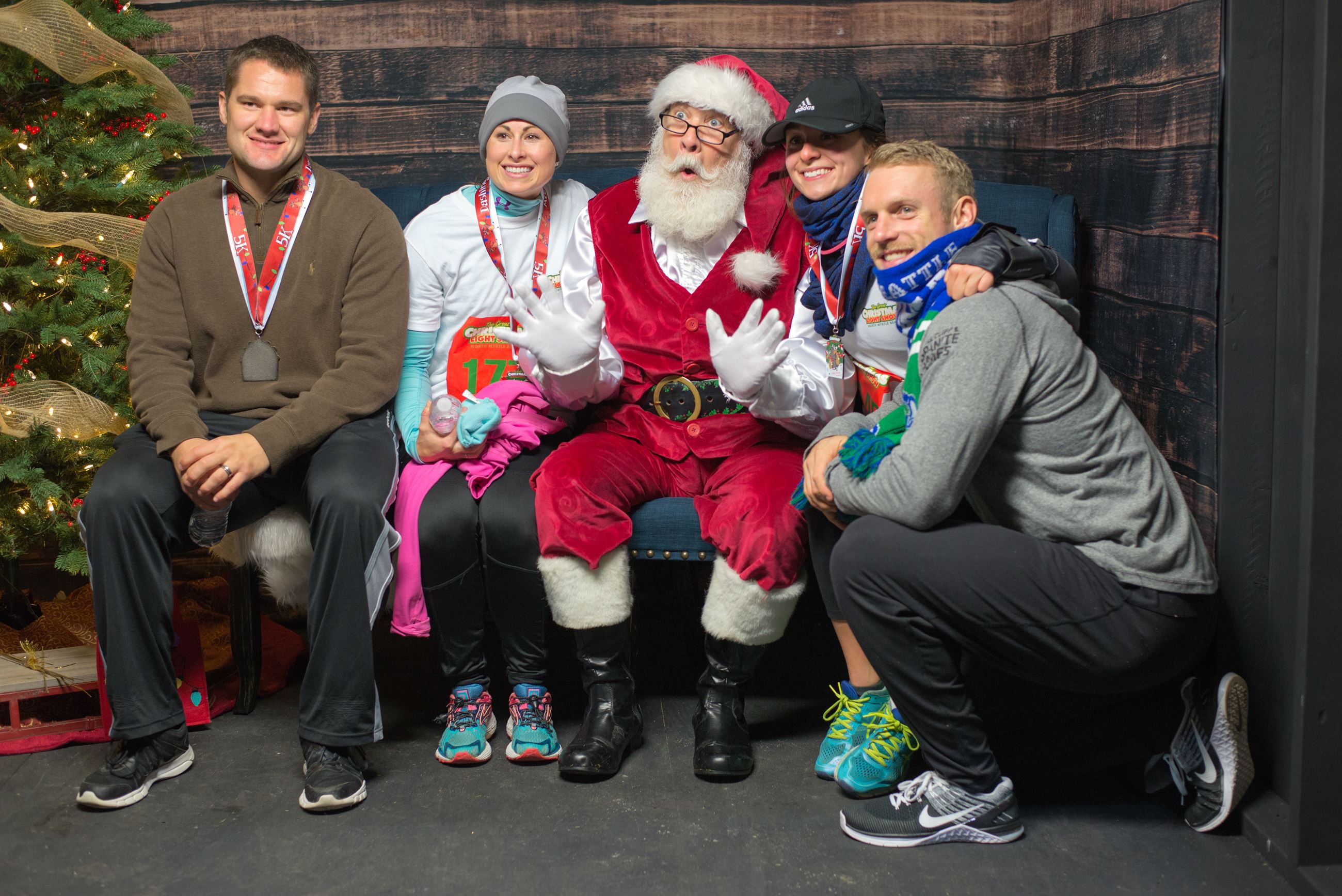 A Group Posing with Santa Claus