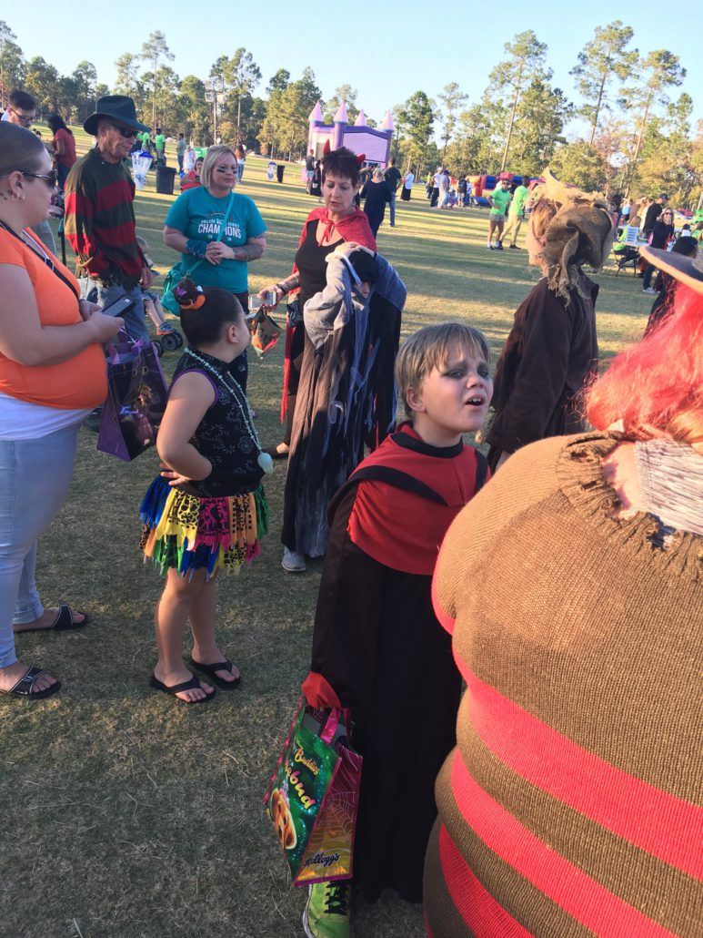 Costumed Howl-O-Scream participants waiting in a line
